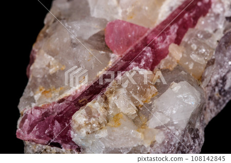 macro mineral tourmaline stone on black background macro mineral tourmaline stone on black background 108142845