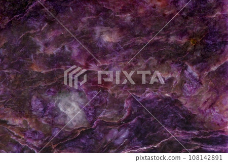 Macro mineral stone Charoite on a white background 108142891
