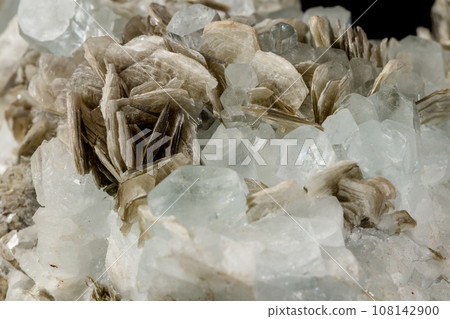 Macro mineral stone Aquamarine in rock on a black background Macro mineral stone Aquamarine in rock on a black background 108142900