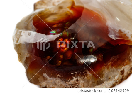 Macro mineral stone fiery Agate on a white background 108142909