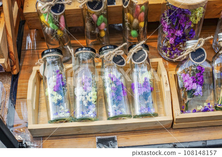 Dried colorful Statice flowers, bunnytail in glass bottles. Multicolored dry flower Limonium, fluff Lagurus ovatus for home decor Dried colorful Statice flowers, bunnytail in glass bottles. Multicolored dry flower Limonium, fluff Lagurus ovatus for home decor 108148157