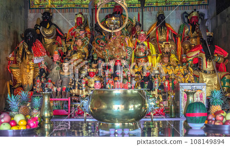 Figurines of deities in chinese Jui Tui temple in Phuket, Thailand. Shrine worship shelf with many gods, selective focus Figurines of deities in chinese Jui Tui temple in Phuket, Thailand. Shrine worship shelf with many gods, selective focus 108149894