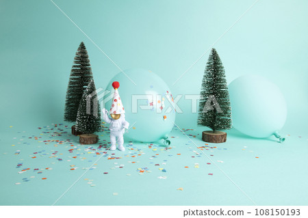 a cosmonaut exploring a snowy forest like a new planet. 108150193