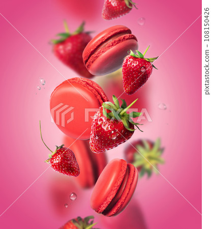 French strawberry macarons with berries on the air. Concept of levitation. Pink background. French strawberry macarons with berries on the air. Concept of levitation. Pink background. 108150426