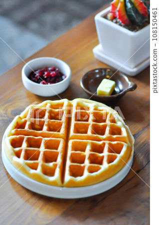 waffle with strawberry dressing and butter waffle with strawberry dressing and butter 108150461