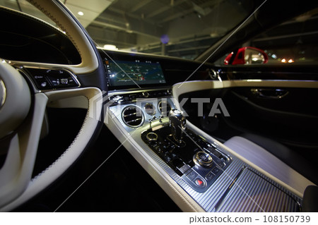 Car interior luxury. Interior of prestige modern car. Dashboard and steering wheel. Car interior luxury. Interior of prestige modern car. Dashboard and steering wheel. 108150739