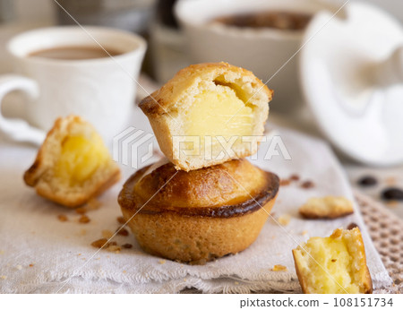 Pasticciotto leccese pastry filled with egg custard cream on a napkin close up 108151734