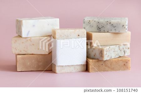 Beige and brown handmade soap bars on light pink close up, soap packaging mockup 108151740