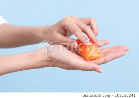 Hand with Sushi Hand with Sushi 108153241
