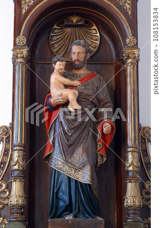 Saint Joseph holding baby Jesus statue on the altar in Parish Church of Our Lady of Snow in Dubranec, Croatia 108153834