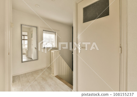 an empty room with white walls and wood flooring on the left side of the room, there is a chalk board that says 108155237