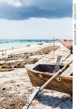beautiful landscape with hammock hanging on palm and boats 108155475