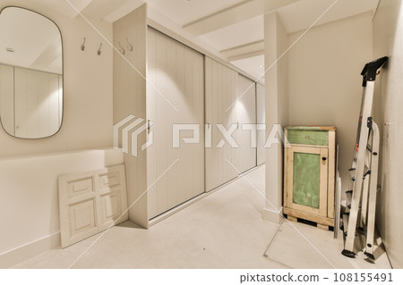 a room that is being remodeled and ready to be used as a dressing area in the closets are empty a room that is being remodeled and ready to be used as a dressing area in the closets are empty 108155491