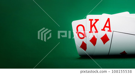 playing cards on a green table 108155538
