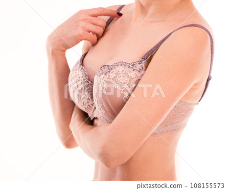 Woman touching her bra strap, isolated 108155573