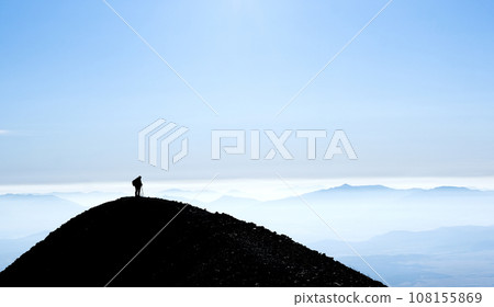 Silhouette of mountain with hiker 108155869