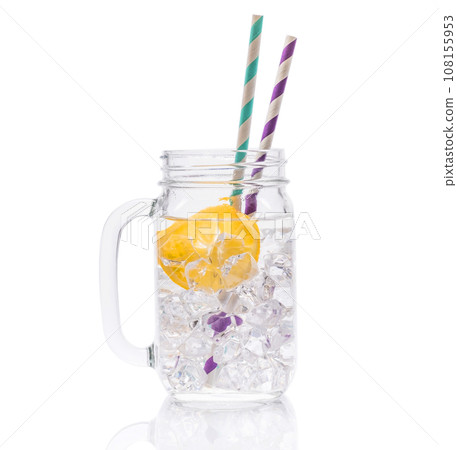 Ice water with lemon and straws 108155953