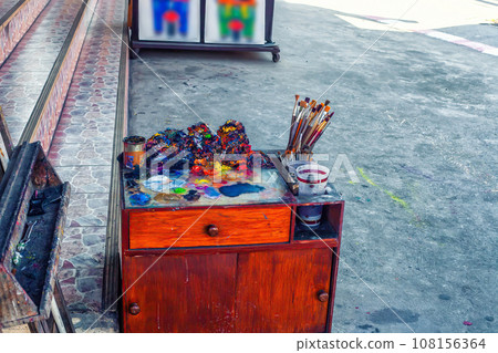 Street painter artists equipment. Painting studio in town street Street painter artists equipment. Painting studio in town street 108156364