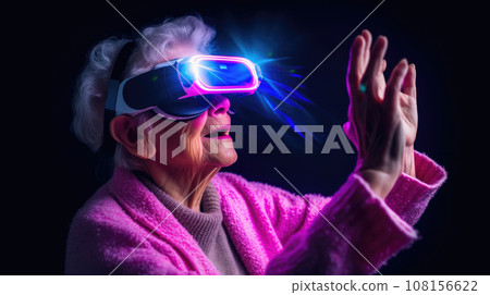 Old granny in VR glasses at virtual reality manages with gestures. pink and blue colors combination 108156622