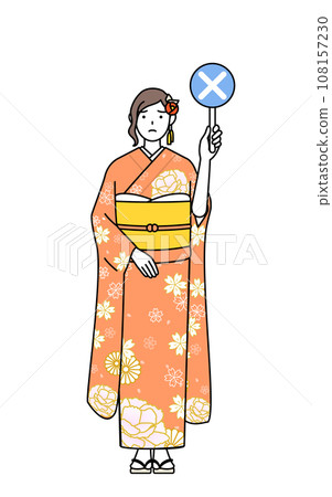 A woman in a long-sleeved kimono holding a cross to indicate an incorrect answer, is often seen at New Year's shrine visits, coming-of-age ceremonies, graduation ceremonies, weddings, etc. 108157230