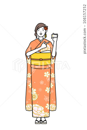 A woman in a long-sleeved kimono recommends payment by credit card, at New Year's shrine visit, coming-of-age ceremony, graduation ceremony, wedding ceremony, etc. A woman in a long-sleeved kimono recommends payment by credit card, at New Year's shrine visit, coming-of-age ceremony, graduation ceremony, wedding ceremony, etc. 108157252