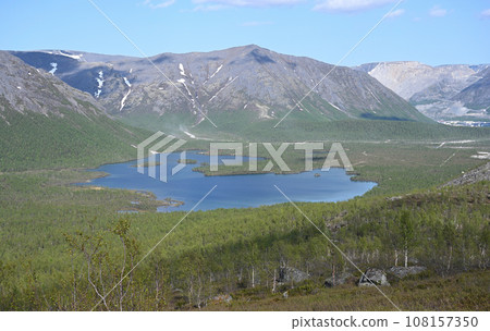 View of a beautiful lake surrounded by the Khibiny Mountains, Russia 108157350
