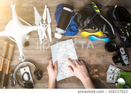 Travelling equipment wooden background 108157822