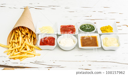 French fries with different sauces 108157962