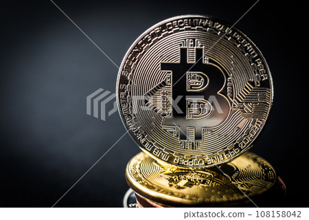 Stack of bitcoins with golden coin on the top 108158042