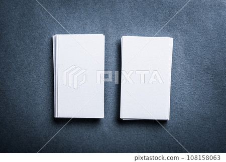 Stacks of blank paper business cards on grey background 108158063