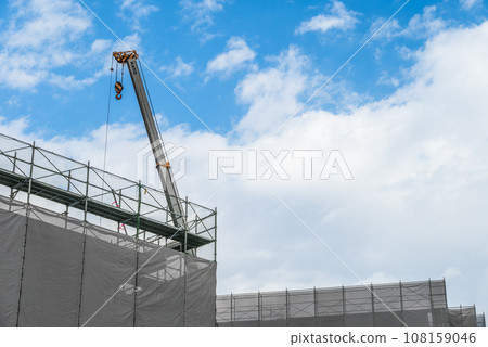 Construction site and crane under blue sky 108159046