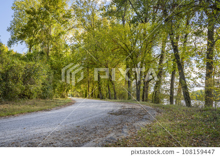 gravel road along Missouri River near Hartsburg, MO, in fall scenery 108159447