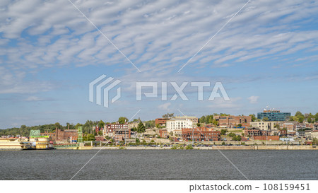 cityscape panorama of Alton in Illinois on a shore of the Mississippi River, a view from the Missouri shore 108159451
