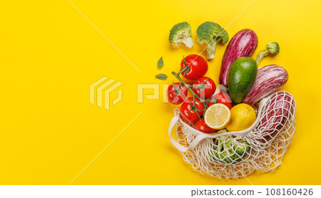 Mesh bag filled with a variety of vegetables Mesh bag filled with a variety of vegetables 108160426