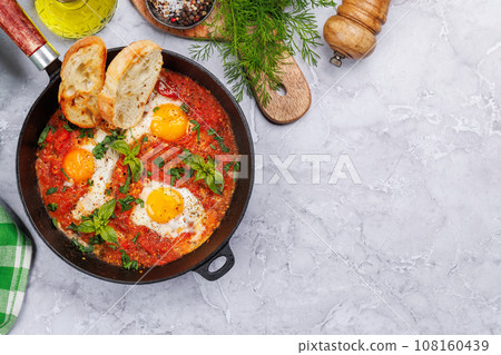 Delicious shakshuka breakfast in a pan 108160439