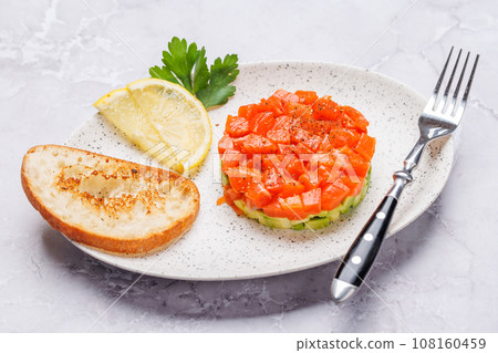Delicious salmon and avocado tartare Delicious salmon and avocado tartare 108160459