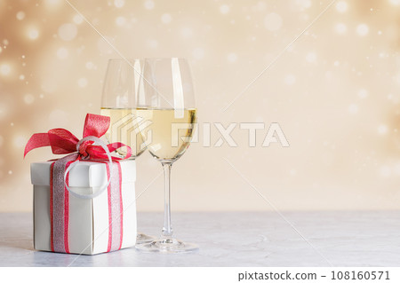 Two champagne glasses and gift box Two champagne glasses and gift box 108160571