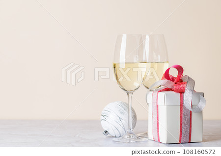 Two champagne glasses and gift box 108160572