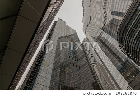 Looking up to highrise office build containing architecture modern design. Looking up to highrise office build containing architecture modern design. 108160876