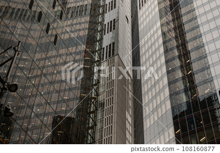 Glass building with transparent facade of the buildings. Glass building with transparent facade of the buildings. 108160877