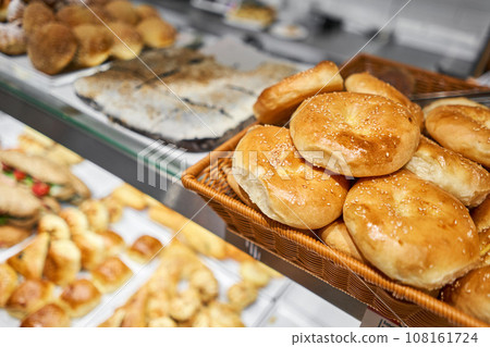 baked pies with different fillings, sweet or salty. Various hot dishes . Glass Showcase in a buffet or self-service restaurant. baked pies with different fillings, sweet or salty. Various hot dishes . Glass Showcase in a buffet or self-service restaurant. 108161724