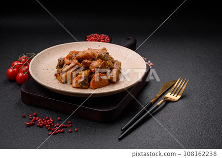 Delicious vegetable stew of potatoes, beef meat, mushrooms, carrots, salt, spices and herbs Delicious vegetable stew of potatoes, beef meat, mushrooms, carrots, salt, spices and herbs 108162238