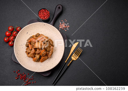 Delicious vegetable stew of potatoes, beef meat, mushrooms, carrots, salt, spices and herbs Delicious vegetable stew of potatoes, beef meat, mushrooms, carrots, salt, spices and herbs 108162239