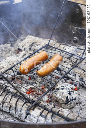sausages grilled on a barbecue 108162431
