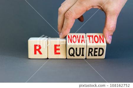 Required and renovation symbol. Concept words Required Renovation on wooden block. Beautiful grey table grey background. Businessman hand. Business required renovation concept. Copy space. 108162752