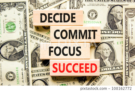Decide commit focus succeed symbol. Concept word Decide Commit Focus Succeed on block. Dollar bills. Beautiful background from dollar bills. Business decide commit focus succeed concept. Copy space. Decide commit focus succeed symbol. Concept word Decide Commit Focus Succeed on block. Dollar bills. Beautiful background from dollar bills. Business decide commit focus succeed concept. Copy space. 108162772