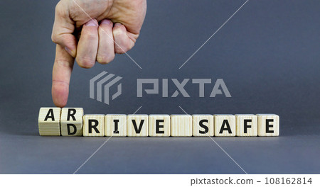 Drive and arrive safe symbol. Concept words Drive safe Arrive safe on wooden blocks. Beautiful grey table grey background. Businessman hand. Business drive and arrive safe concept. Copy space. Drive and arrive safe symbol. Concept words Drive safe Arrive safe on wooden blocks. Beautiful grey table grey background. Businessman hand. Business drive and arrive safe concept. Copy space. 108162814