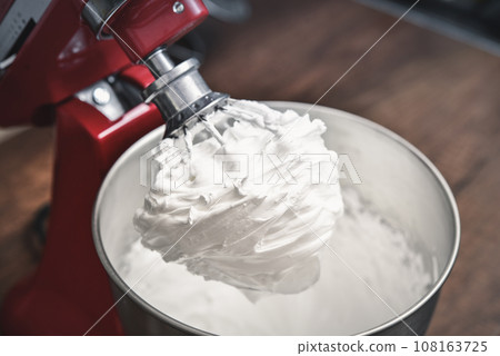 Whipped egg whites - beaten italian meringue 108163725