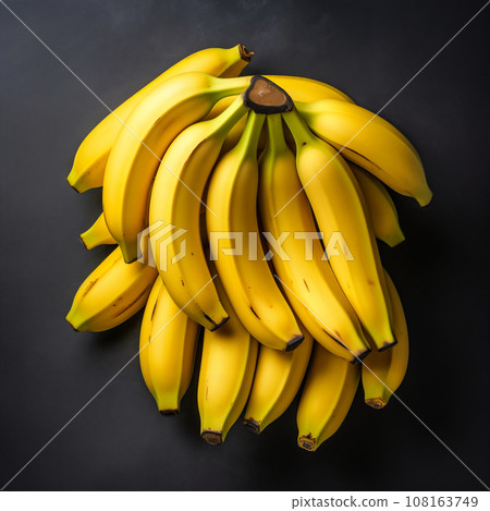 a bunch of bananas on a gray background a bunch of bananas on a gray background 108163749