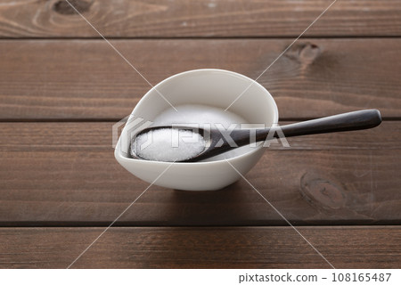 salt and wooden spoon 108165487